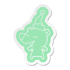cartoon  sticker of a bear wearing santa hat