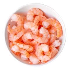 Peeled shrimps in a bowl isolated on white background. Top view.