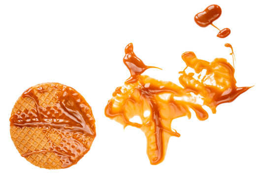 Caramel  round waffle with Caramel sauce isolated on white background. Dutch stroopwafel with Golden Butterscotch toffee syrup, top view