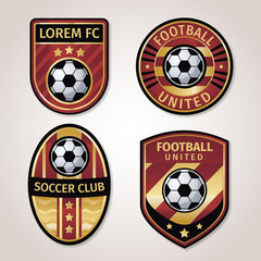 Golden soccer or football badge collection with black and gold star combination.