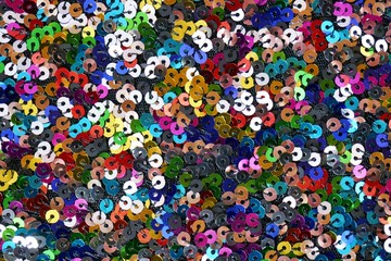 Sequins macro background.Multicolored sequins.iridescent fabric.Scales background. fabric background.sparkling sequined textile	