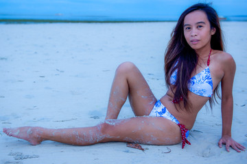 Young Filipino girl at beach in bikini