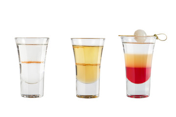 Set of alcohol shots on a white background. Three shots varied.