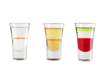 Set of alcohol shots on a white background. Three shots are popular.