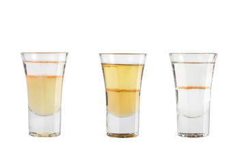 Set of alcohol shots on a white background. Three shots strong alcohol.