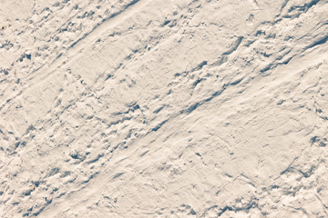 High angle view of snow texture in pink tone, background with copy space
