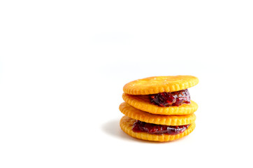 stack of  biscuit with strawberry jam on white background