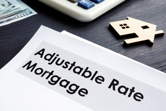 Adjustable Rate Mortgage ARM Documents On A Table.