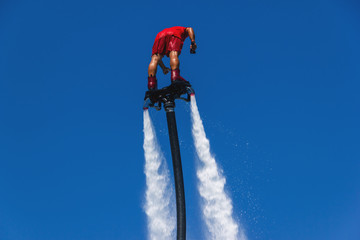 fly board, man on a Flyboard in red