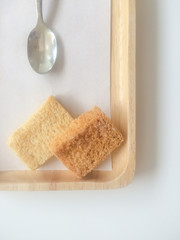 Fototapeta na wymiar Bread Butter Sugar on wooden tray on white background.
