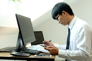 business man  sit at ther table looking at computer laptop in the office