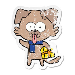 distressed sticker of a cartoon dog with christmas present