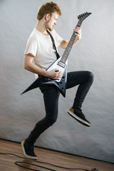 Fototapeta premium Man playing on electric guitar