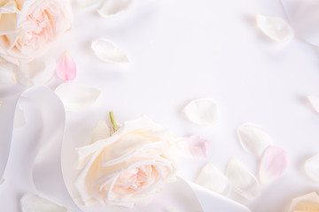 Festive flower composition on the white wooden background. Overhead view