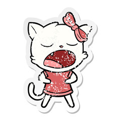 distressed sticker of a cartoon yawning cat