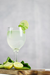 Lime juice, limes slice with mint leaves on table, Fresh drink lemonade.