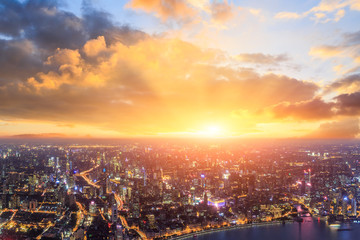 Shanghai city skyline and beautiful colorful clouds at sunset