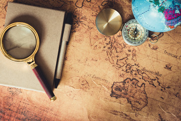 Navigation Explore of Journey Planning., Travel Destination and Expedition Plan Vacation trip., Close Up of Layout Magnifying Glass, Calendar, Compass, Airplane Model and Global Model on a Table.