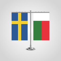 Table stand with flags of Sweden and Madagascar.Two flag. Flag pole. Symbolizing the cooperation between the two countries. Table flags