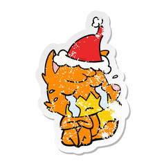 crying fox distressed sticker cartoon of a wearing santa hat