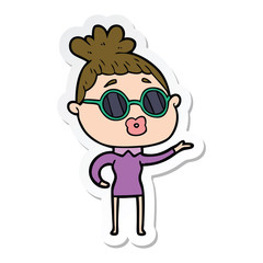 sticker of a cartoon woman wearing sunglasses