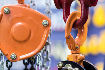 orange hook for industrial crane ; equipment background