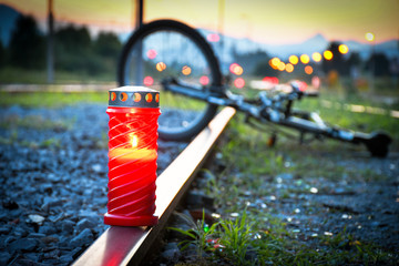 Fatal bicyclist and train crash accident when crossing rail road. Train accident with red candle...