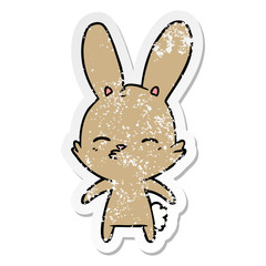 distressed sticker of a curious bunny cartoon