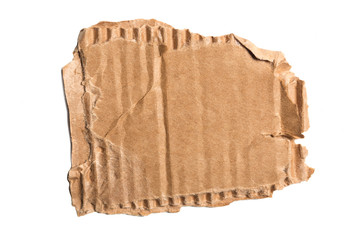 Brown corrugated cardboard torn piece isolated on white background.