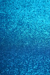 Glitter  wallpaper.  Glitter blue iridescent macro background with stars. Shiny backdrop.Snowy blue...