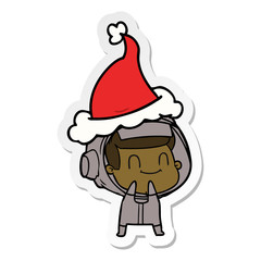happy sticker cartoon of a astronaut wearing santa hat