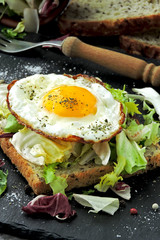 Toast with fried egg and salad. Keto breakfast or snack.
