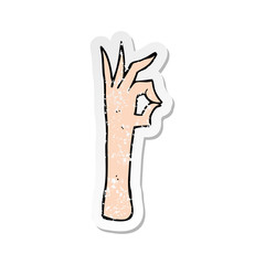 retro distressed sticker of a cartoon okay hand gesture