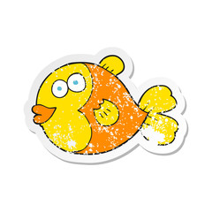 retro distressed sticker of a cartoon fish