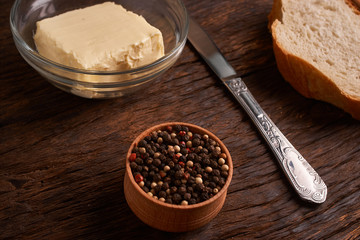 Top view of sliced wholegrain bread on dark ructic wooden background closeup