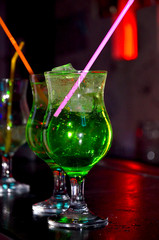 Green cocktails on the bar counter