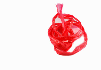 Red plastic rope isolated in white background