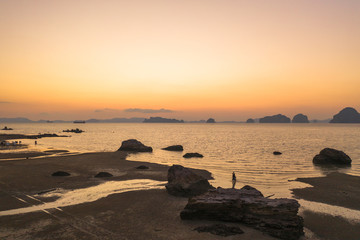 Tup Kaek beach close to Kwang beach and non Nak mountain during low tide .can see long and large beach can walk around many big rocks on the beach .beautiful sunset behind archipelago in Andaman sea