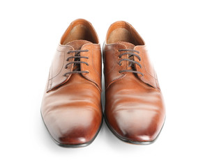 Pair of stylish male shoes on white background