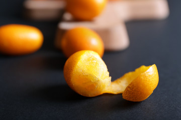 Delicious kumquat fruit on dark background