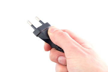 electric plug in hand on white background