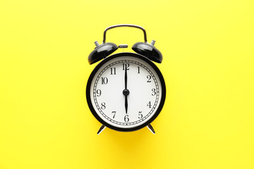 Alarm clock on color background
