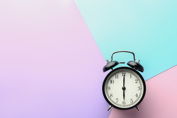 Alarm clock on color background