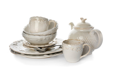 Set of clean tableware on white background