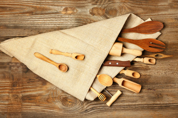 Fototapeta na wymiar Set of kitchenware on wooden background