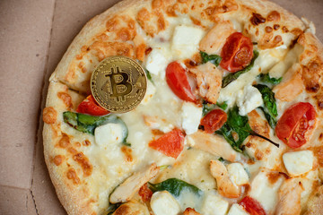Bitcoin Pizza Day 22 May. Cryptocommunity holiday. concept of buying pizza with bitcoin.