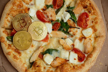 Bitcoin Pizza Day 22 May. Cryptocommunity holiday. concept of buying pizza with bitcoin.