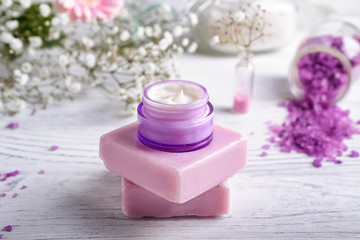 Obraz na płótnie Canvas Jar of natural cream with soap on white table