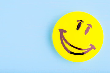 Smiling emoji. Оn blue background