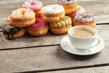 Glazed donuts on wooden background